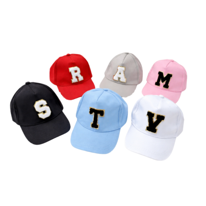 Colorful baseball caps with embroidered initial letters in various colors